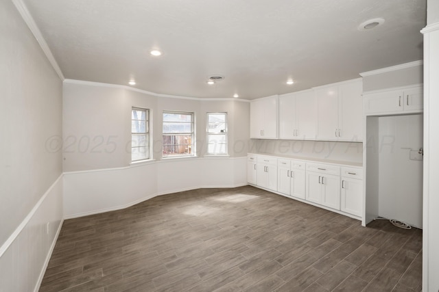 3506 Barclay Dr, Amarillo, TX 79109 - kitchen featuring white cabinets, crown molding, dark wood-type flooring, light countertops, and recessed lighting