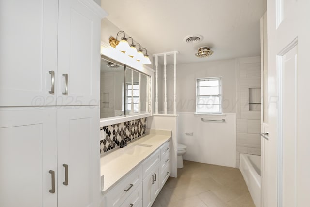 3506 Barclay Dr, Amarillo, TX 79109 - bathroom with vanity, tile patterned floors, and tasteful backsplash