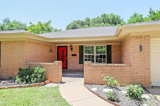 3506 Barclay Dr, Amarillo, TX 79109 - entrance to property with brick siding, roof with shingles, a garage, and covered porch