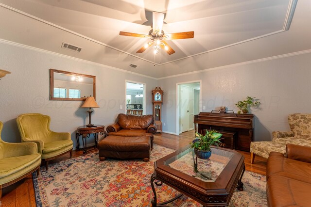 6211 Edgeware Pl, Amarillo, TX 79109 - living area featuring ceiling fan, wood finished floors, and ornamental molding