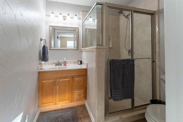 6211 Edgeware Pl, Amarillo, TX 79109 - bathroom with a shower stall, vanity, and tile patterned flooring