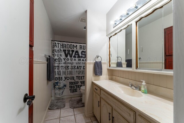 6211 Edgeware Pl, Amarillo, TX 79109 - full bath featuring vanity, tile patterned flooring, a shower with shower curtain, and a wainscoted wall