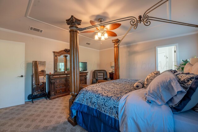 6211 Edgeware Pl, Amarillo, TX 79109 - bedroom featuring carpet, a tray ceiling, ornamental molding, ceiling fan, and decorative columns