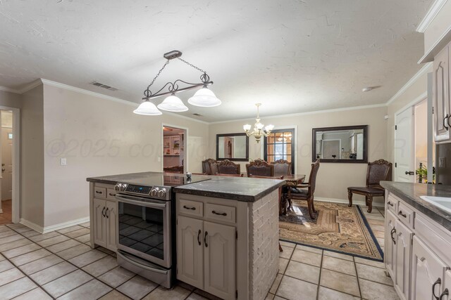 6211 Edgeware Pl, Amarillo, TX 79109 - kitchen featuring stainless steel range with electric cooktop, dark countertops, light tile patterned floors, a chandelier, and ornamental molding