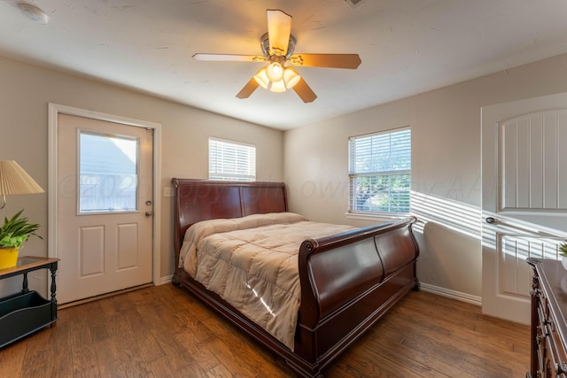 6211 Edgeware Pl, Amarillo, TX 79109 - bedroom featuring multiple windows, wood finished floors, and a ceiling fan