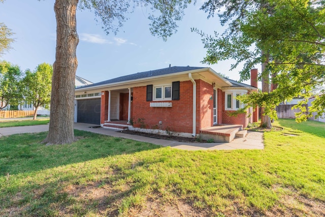 ranch-style home with a front yard and a garage