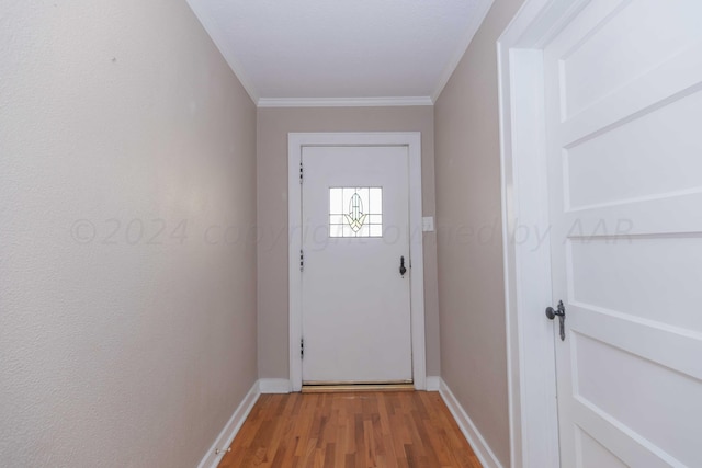 entryway featuring hardwood / wood-style floors and ornamental molding