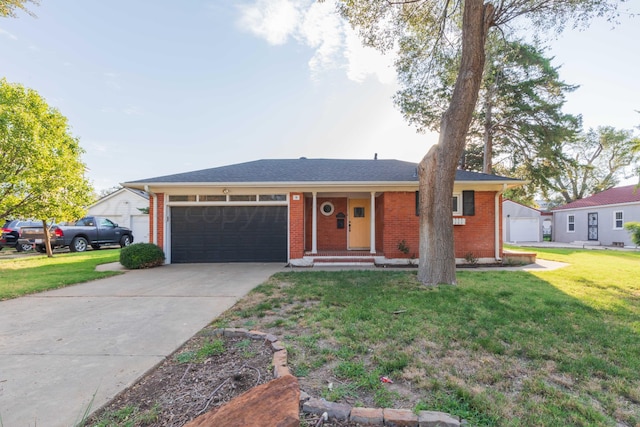 view of front of home with a front lawn and a garage