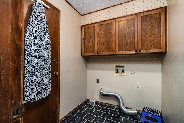 6700 Deer Park Dr, Amarillo, TX 79124 - laundry area featuring cabinet space, tile patterned floors, a textured ceiling, hookup for an electric dryer, and ornamental molding