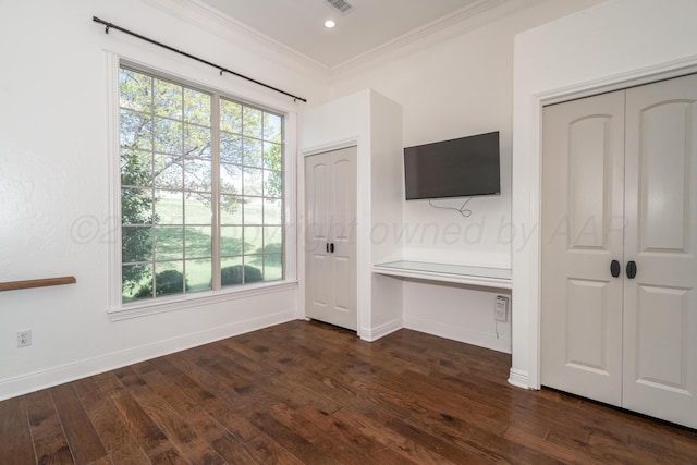 unfurnished bedroom featuring dark wood-style floors, visible vents, baseboards, recessed lighting, and ornamental molding