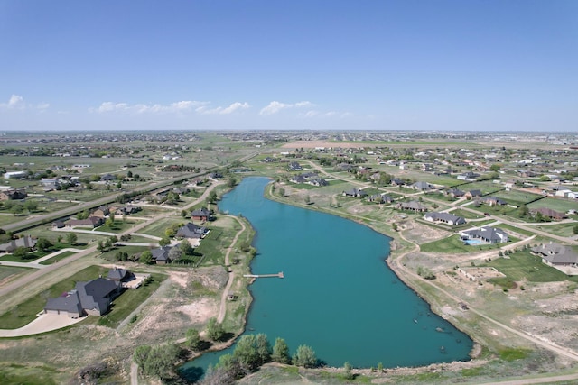bird's eye view featuring a residential view and a water view