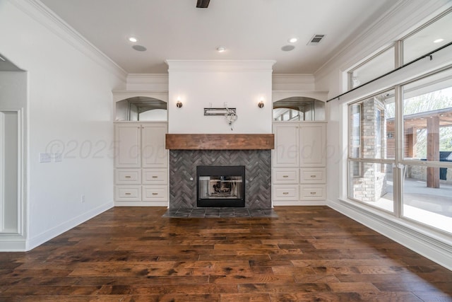 unfurnished living room featuring dark wood-type flooring, arched walkways, crown molding, and baseboards