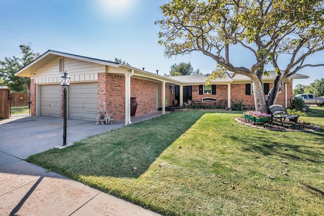 ranch-style house featuring a garage and a front lawn