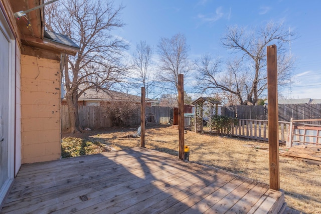 deck with a fenced backyard