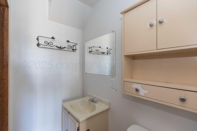 bathroom with toilet and vanity