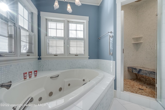 2223 S Ong St, Amarillo, TX 79109 - bathroom featuring a stall shower, healthy amount of natural light, a jetted tub, and a chandelier