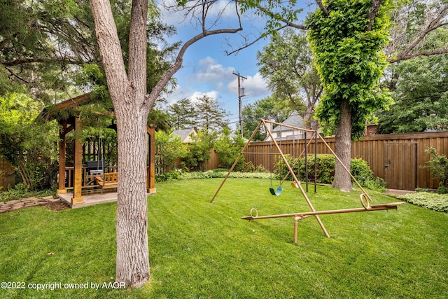2223 S Ong St, Amarillo, TX 79109 - fenced backyard featuring a patio and a playground