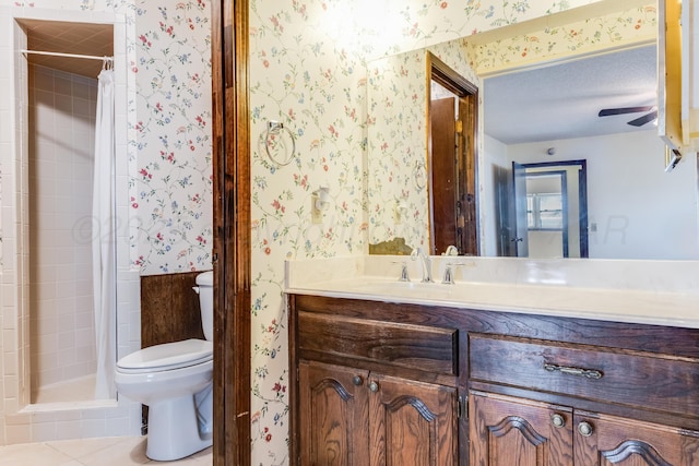 full bathroom featuring toilet, a shower stall, vanity, and wallpapered walls