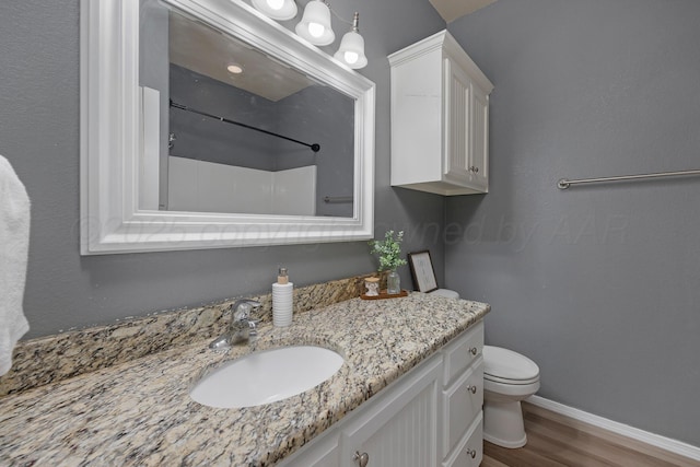 6809 Fanchun St, Amarillo, TX 79119 - bathroom with wood finished floors, a shower, and vanity