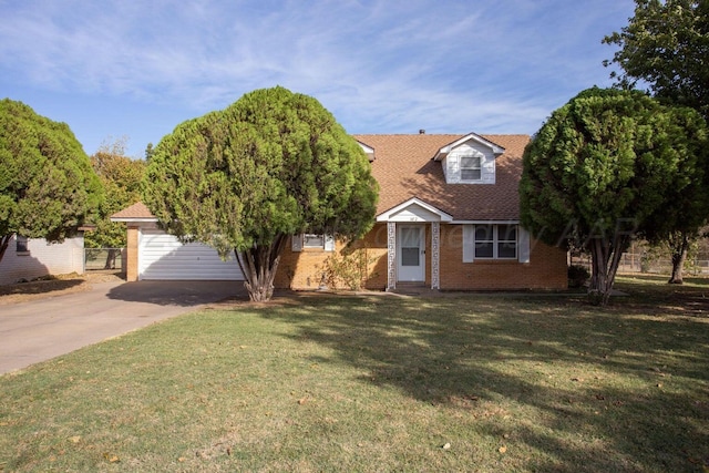 cape cod-style house featuring brick siding and a front yard