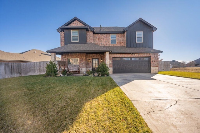 view of front of home with a garage and a front yard