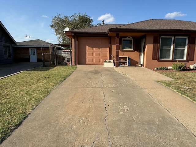 single story home with a garage and a front yard