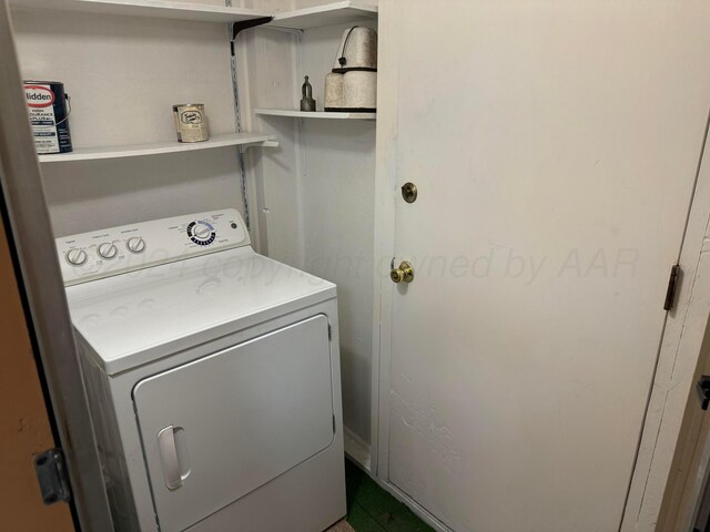 laundry room featuring washer / dryer