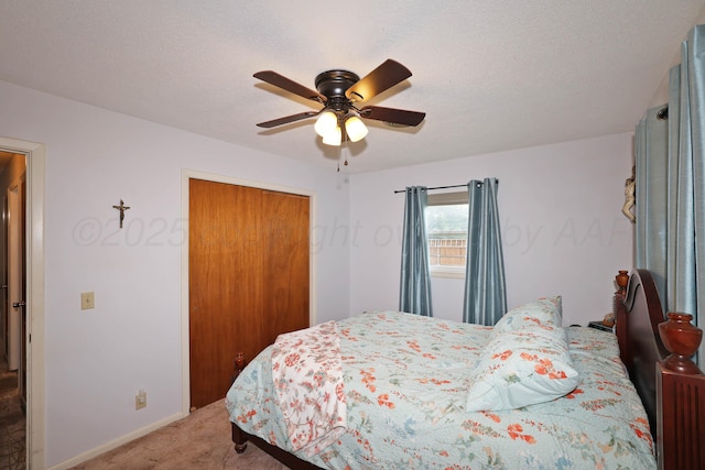 2901 Carter St, Amarillo, TX 79103 - bedroom featuring light carpet, a closet, a ceiling fan, and baseboards