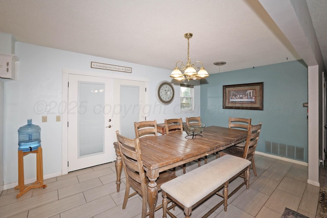 2901 Carter St, Amarillo, TX 79103 - dining area with a chandelier, baseboards, wood finish floors, and french doors