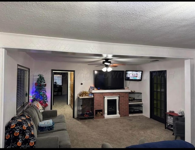 100 Bunavista St, Borger, TX 79007 - carpeted living room featuring ceiling fan, a brick fireplace, and a textured ceiling