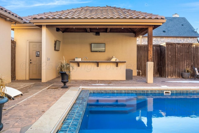 view of swimming pool with a patio