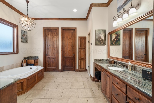 bathroom featuring a bathtub, tile patterned flooring, vanity, a notable chandelier, and crown molding