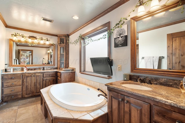 bathroom with a relaxing tiled tub, vanity, and ornamental molding