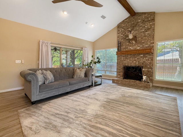 8 Glenbrook Dr, Borger, TX 79007 - living room featuring beam ceiling, wood finished floors, ceiling fan, high vaulted ceiling, and a fireplace