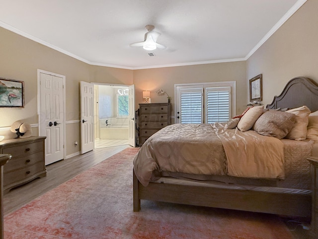 8 Glenbrook Dr, Borger, TX 79007 - bedroom featuring wood finished floors, crown molding, connected bathroom, and a ceiling fan