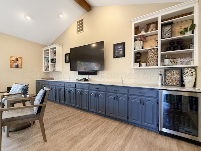 8 Glenbrook Dr, Borger, TX 79007 - living room with beverage cooler and light wood-style floors