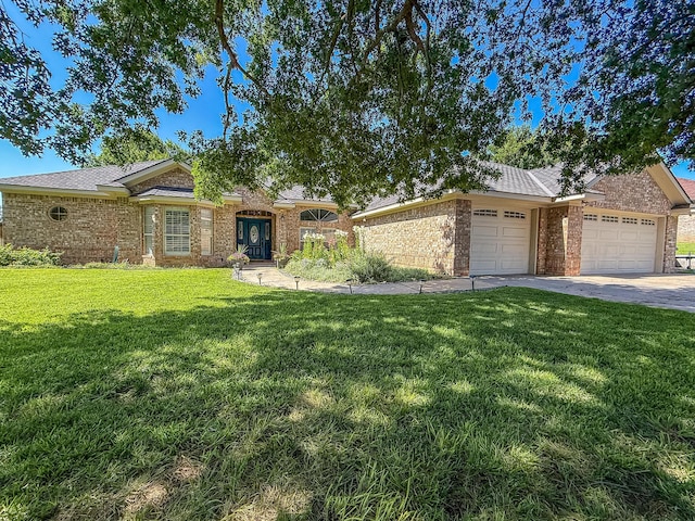 8 Glenbrook Dr, Borger, TX 79007 - view of front of home featuring an attached garage, brick siding, a front yard, and driveway