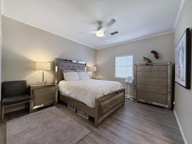 8 Glenbrook Dr, Borger, TX 79007 - bedroom featuring crown molding, wood finished floors, and a ceiling fan