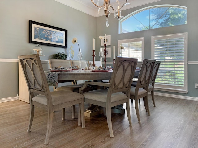 8 Glenbrook Dr, Borger, TX 79007 - dining room featuring a chandelier, light wood-type flooring, and crown molding