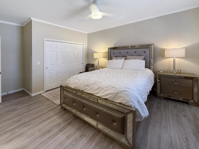 8 Glenbrook Dr, Borger, TX 79007 - bedroom with wood finished floors, ornamental molding, a closet, and a ceiling fan