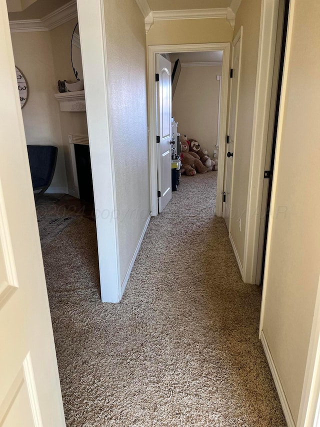 hallway with carpet and ornamental molding