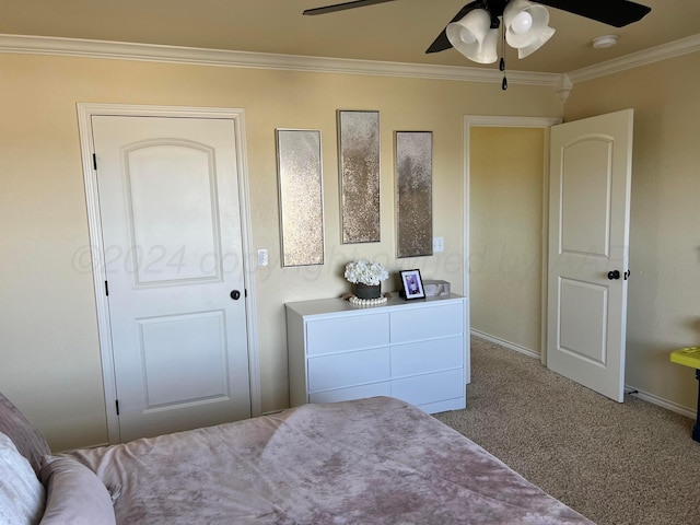 carpeted bedroom featuring ceiling fan and crown molding