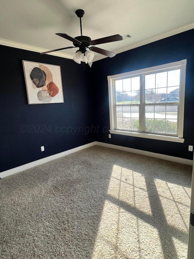 carpeted spare room with a water view, ceiling fan, and ornamental molding