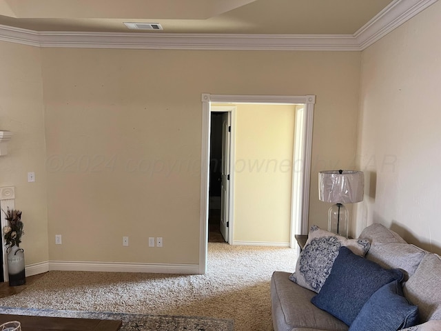 living area featuring carpet floors and crown molding