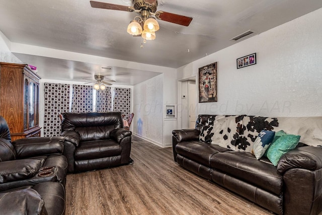 living room with hardwood / wood-style flooring and ceiling fan