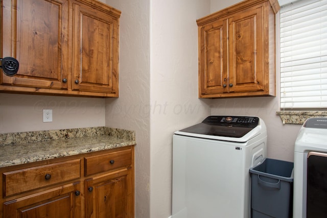 5401 Walesa Ct, Amarillo, TX 79119 - laundry room with washing machine and clothes dryer and cabinet space