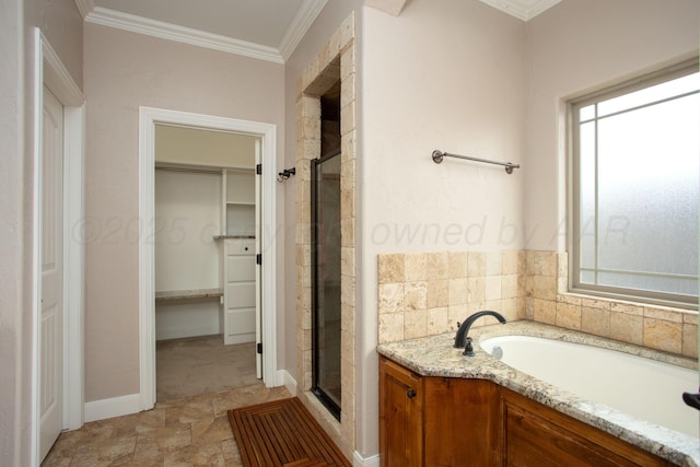 5401 Walesa Ct, Amarillo, TX 79119 - bathroom with a spacious closet, a stall shower, a bath, and ornamental molding