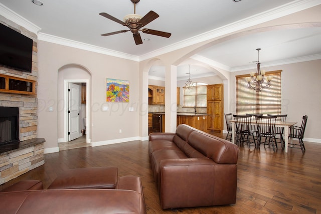 5401 Walesa Ct, Amarillo, TX 79119 - living room featuring a chandelier, arched walkways, a stone fireplace, hardwood / wood-style floors, and ceiling fan