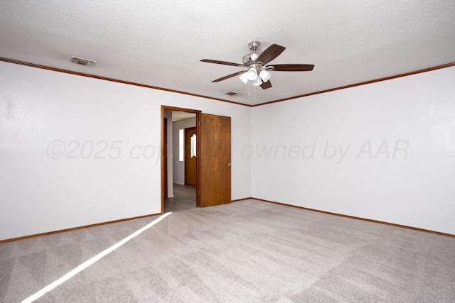 7408 Sleepy Hollow Blvd, Amarillo, TX 79121 - unfurnished room with carpet floors, ceiling fan, crown molding, baseboards, and a textured ceiling