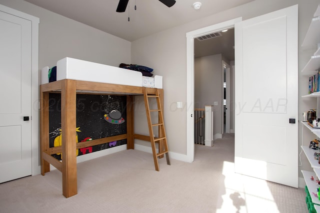 bedroom featuring ceiling fan and light colored carpet